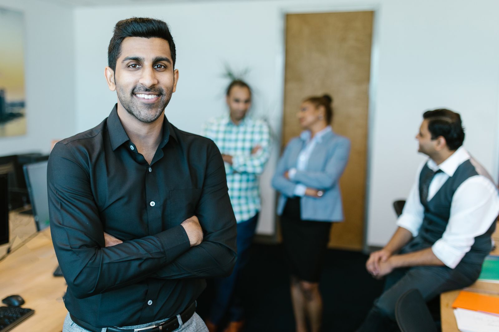 Professionals collaborating in a modern workplace